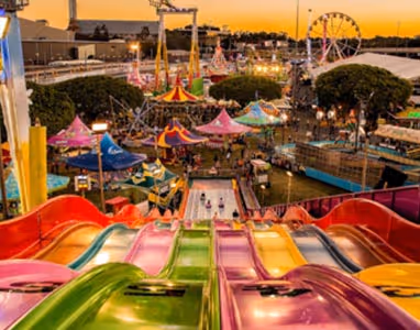 Image of the Ekka Festival taken looking down from a big slide, looking out to the rest of the rides.